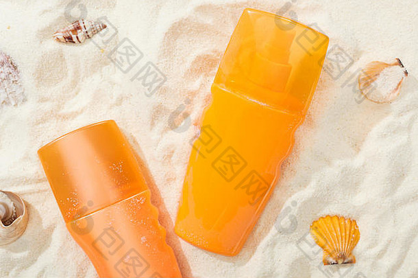橙色瓶防晒霜金沙子贝壳
