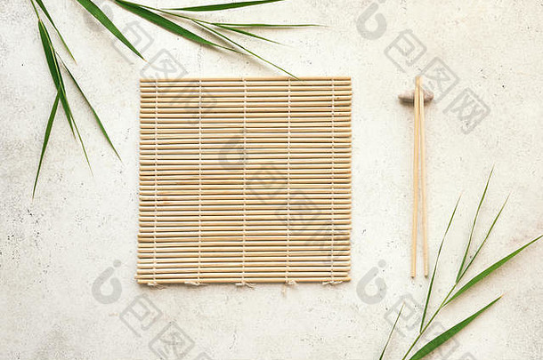 亚洲食物背景筷子竹子席竹子叶子光背景亚洲菜单设计中国人日本厨房概念