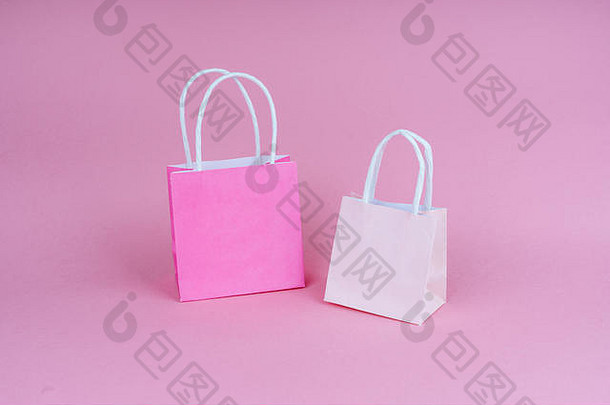 纸购物礼物袋粉红色的背景复制斯帕埃概念销售购物黑色的星期五给礼物生日圣诞节是的