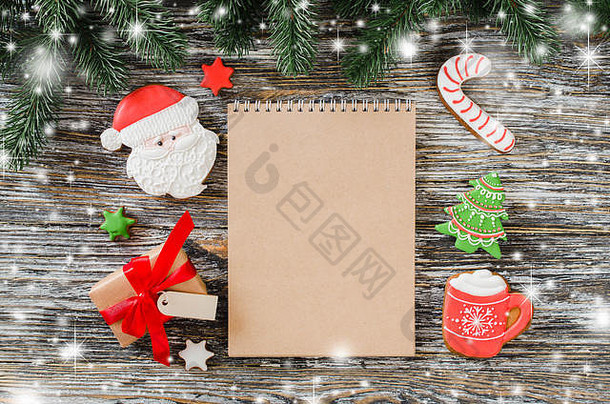 圣诞节背景棕色（的）笔记本姜饼饼干冷杉树乡村木表格前视图复制空间写作礼物列表去把握