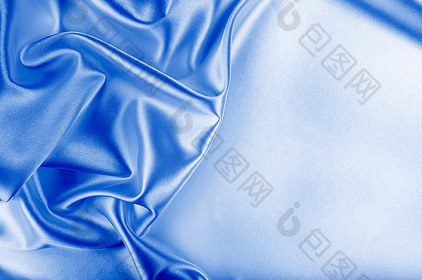 蓝色的丝绸织物纹理布料摘要背景