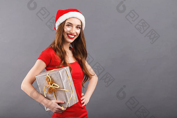 美丽的圣诞节女人穿圣诞老人他红色的衣服相机持有现在一年圣诞节假期记忆礼物<strong>购</strong>物折扣商店雪少女圣诞老人老人化妆发型<strong>狂欢</strong>节
