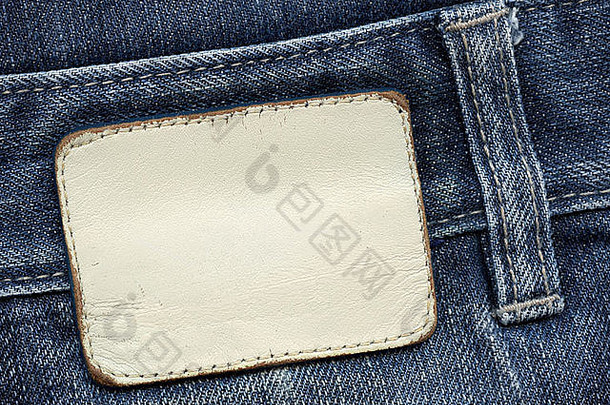 空白皮革牛仔裤标签缝蓝色的牛仔裤背景文本