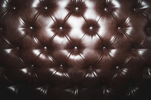 皮革室内装潢纹理沙发棕色（的）奢侈品沙发上关闭背景