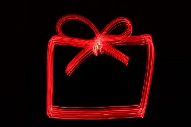 光绘画照片节日圣诞节形状红色的霓虹灯颜色黑色的背景长曝光摄影