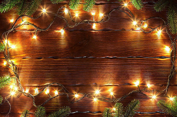 圣诞节散景<strong>背景</strong>发<strong>光</strong>的金加兰棕色（的）木表格分支机构圣诞节树