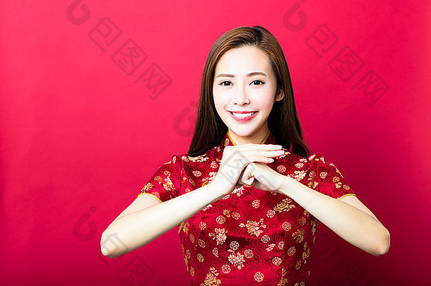 快乐中国人一年年轻的女人祝贺手势