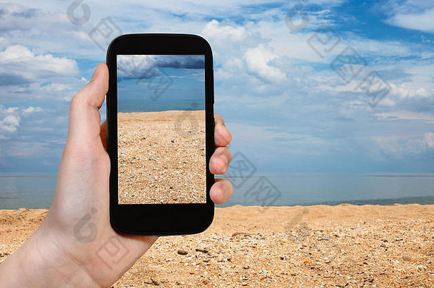 旅行概念旅游照片雪莱沙子海滩亚速海海智能手机