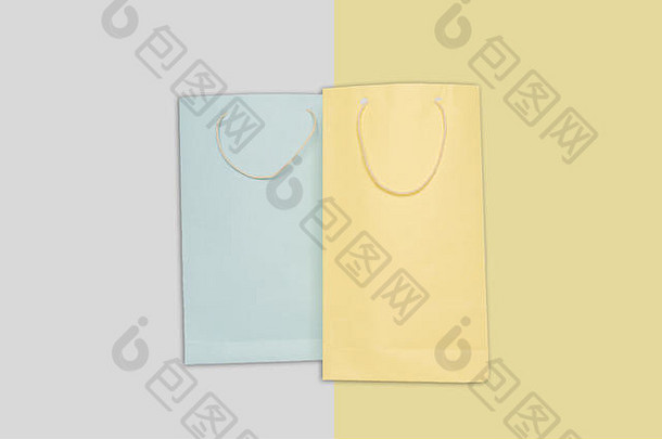 光蓝色的黄色的颜色购物纸袋及背景