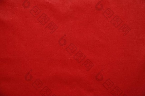 红色织物纹理。以纺织材料为背景。