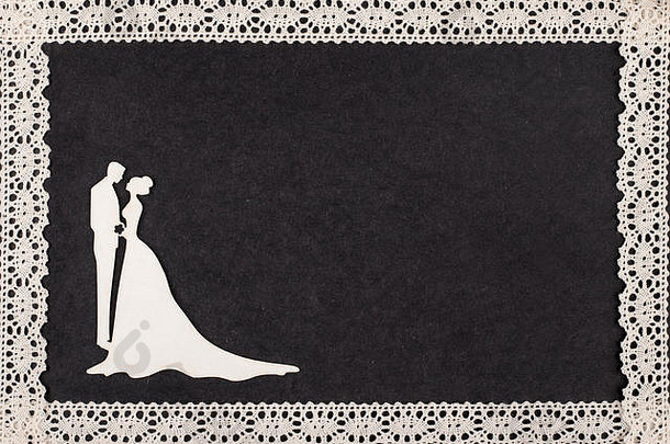 复古相册页面上的新娘和新郎剪影镶有花边。