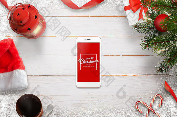 英雄头像圣诞现场，手机中间带着圣诞快乐的信息。圣诞树，礼物，白色木桌上的装饰品。