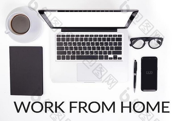 工作首页概念设备配件办公室桌子上表格笔记本移动PC电脑杯咖啡眼镜笔文具移动