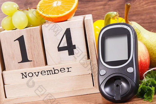 立方体日历上的<strong>11</strong>月14日，<strong>血</strong>糖仪和新鲜水果蔬菜，世界糖尿病日的概念