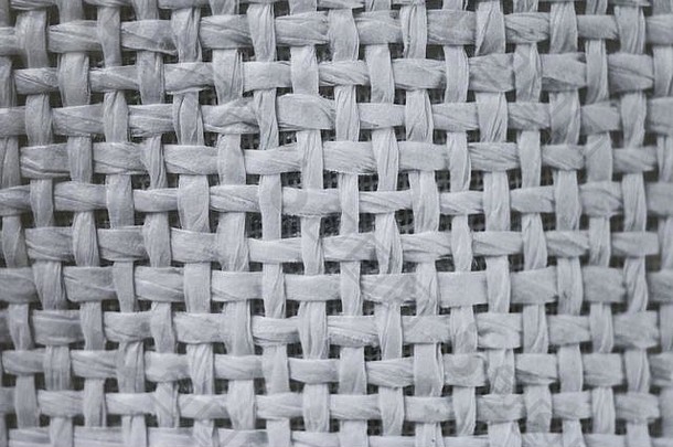 特写麻布背景。白色粗麻袋的编织结构