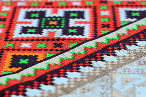 乌克兰传统民间艺术在纺织面料上编织刺绣图案。彩色像素设计针织帆布。