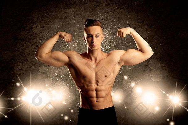 一个有吸引力的肌肉男练习举重，展示上身，配上插图灯光和bokeh概念