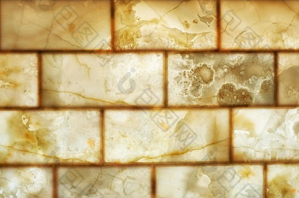 玛瑙砖墙背景。蜂蜜色玛瑙材质的纹理。