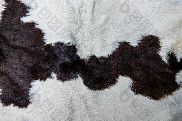 棕色牛皮被毛的纹理，带有黑色、白色和棕色斑点