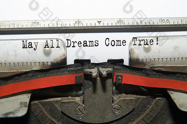 一张写着“愿所<strong>有梦想</strong>成真”的纸在打字机里