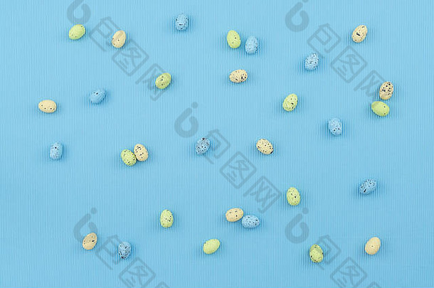 摘要色彩斑斓的复活节蛋模式蓝色的波纹纸纹理背景蛋亨特快乐复活节概念