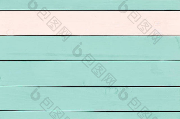 背景纹理的彩色绿色染色木材与单一木板的玫瑰色木材作为边界在顶部在一个完整的框架