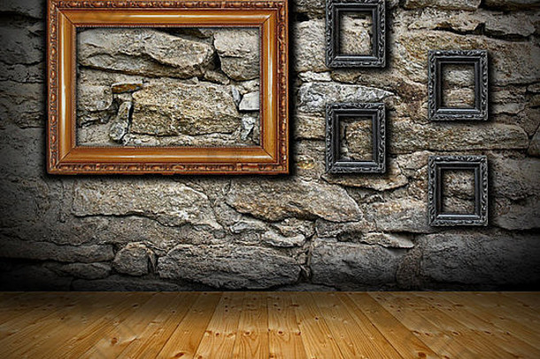 带石墙和木地板的室内背景-一些古老的空画框可供您设计