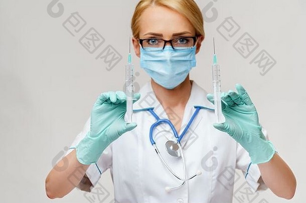 医疗医生护士女人穿保护面具手套持有注射器