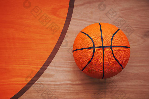 篮球放在硬木球场地板上，俯视图
