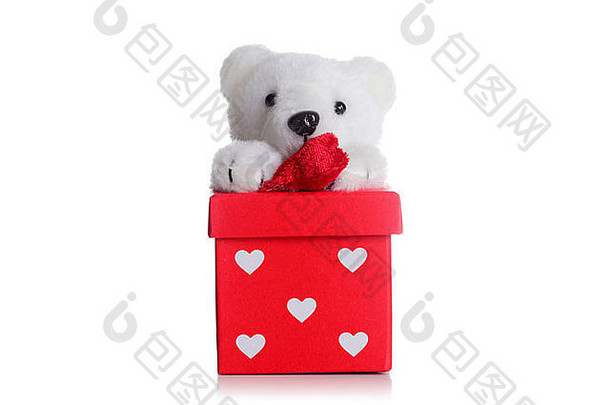 红色礼品盒上印有心形图案的泰迪熊
