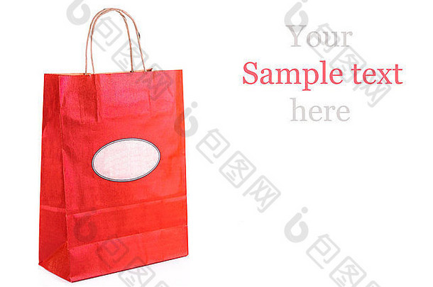 红色纸购物袋隔离在白色纸上。购物理念。