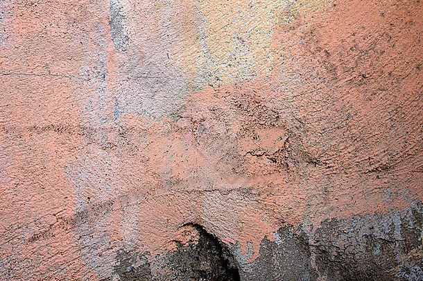鲑鱼粉色混凝土墙的抽象背景图像。