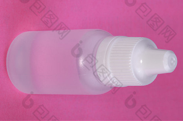 白色塑料瓶粉红色的背景