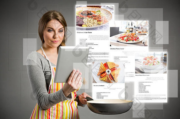 年轻女子使用平板电脑做饭，从平板电脑中取出五颜六色的社交媒体图标