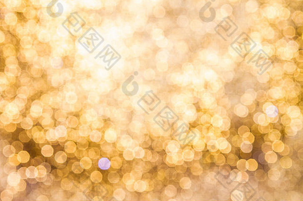 金色叠加背景的金色灯光与博克效果。包括拷贝空间。