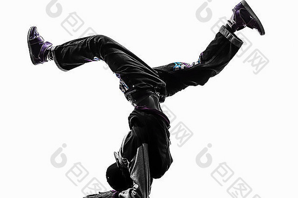 一个嘻哈杂技霹雳舞者霹雳舞年轻男子倒立剪影白色背景