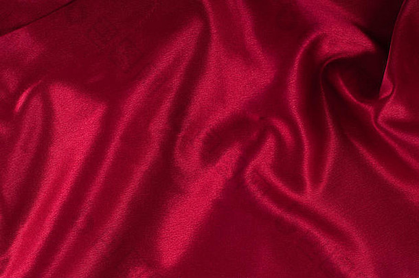 红色的柔滑的纺织背景