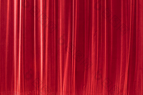 红色背景纹理，看起来像丝绸织物或窗帘。这是一个无缝的瓷砖图案。