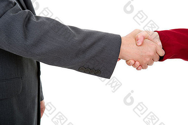 一对商务夫妇隔着一张白纸握手