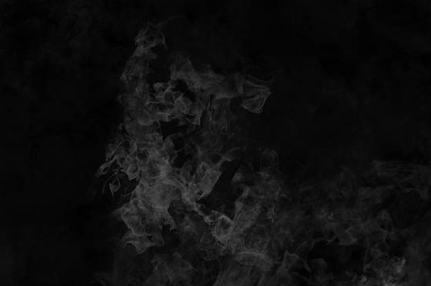 烟地板上孤立的黑色的背景有雾的雾效果纹理覆盖文本空间