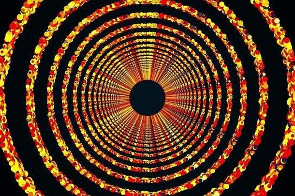 由彩色亮片组成的圆环形成了一个由计算机生成的无休止的隧道。明亮明亮背景的三维渲染