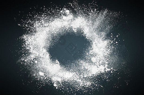 粉尘爆炸背景的抽象设计。在黑暗背景上喷洒的粉末颗粒