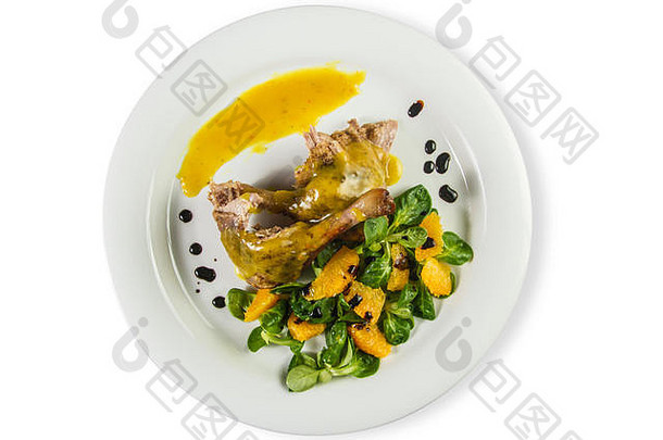 <strong>鸭</strong>腿橙色酱汁羊肉的生菜沙拉橙子vinegaron白色板孤立的白色