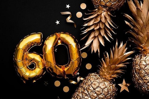 以金气球和金菠萝为背景的60岁生日庆祝活动