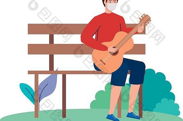 年轻的男人。穿医疗面具玩吉他坐着公园椅子