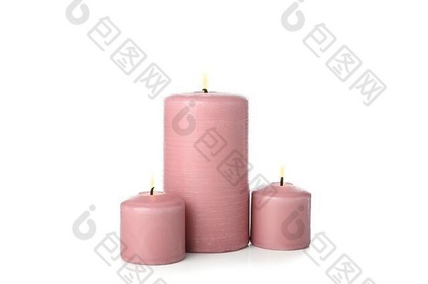 粉红色的燃烧蜡烛孤立的白色背景