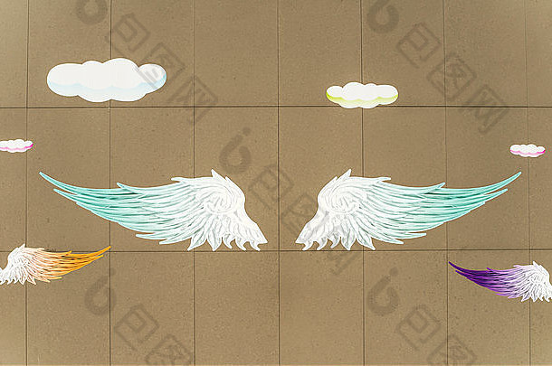 画在墙上的天使翅膀插图背景
