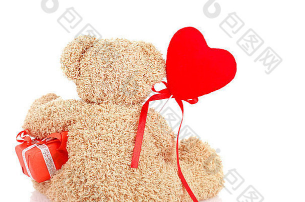 图像可爱的毛茸茸的泰迪熊坐着回来一边持有礼物盒子红色的心形的气球软玩具现在