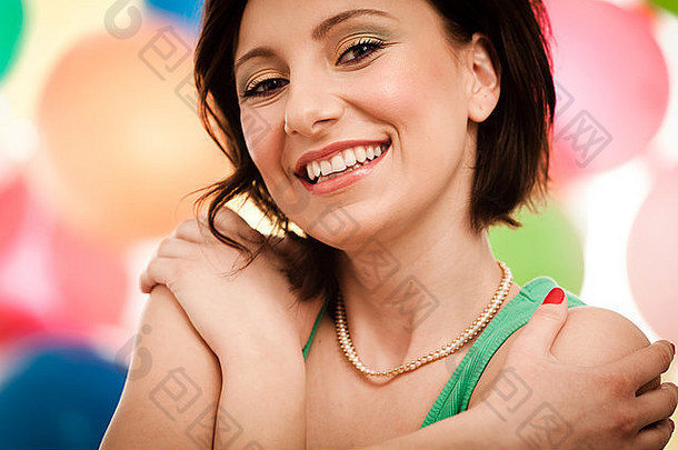 肖像可爱的女孩前面彩色的背景专业化妆应用图片拍摄
