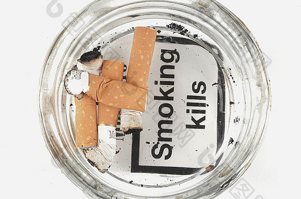 香烟屁股烟灰缸股票图像“吸烟杀死的政府健康警告